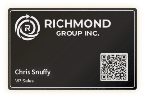 A digital business card featuring a black background. The card displays the logo of Richmond Group Inc., with the name "Chris Snuffy" and the title "VP Sales". There is a QR code on the right side for digital contact sharing.